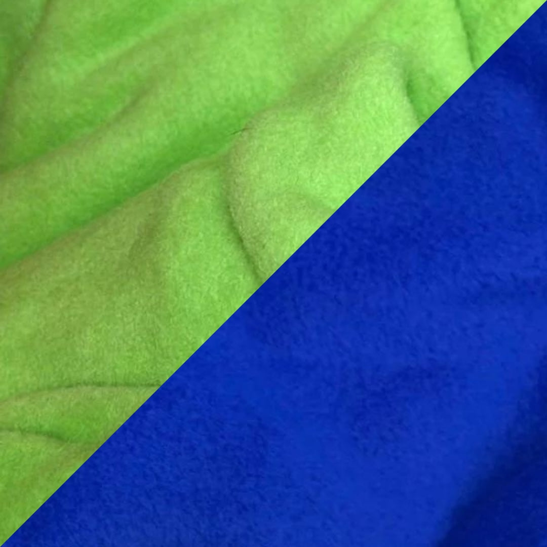 Close-up of a lime green and electric blue reversible fleece dog snood.