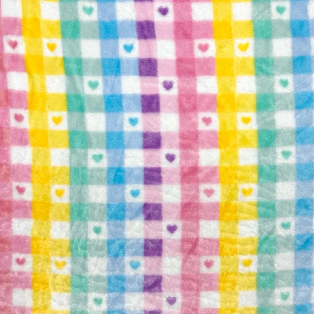 Colourful checkered fabric with heart patterns in various colours