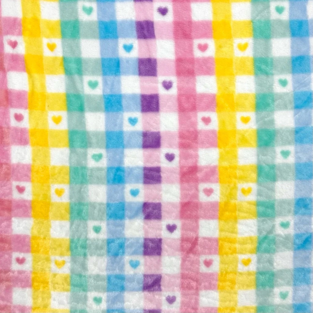 Colorful checkered fabric with heart patterns in various colors
