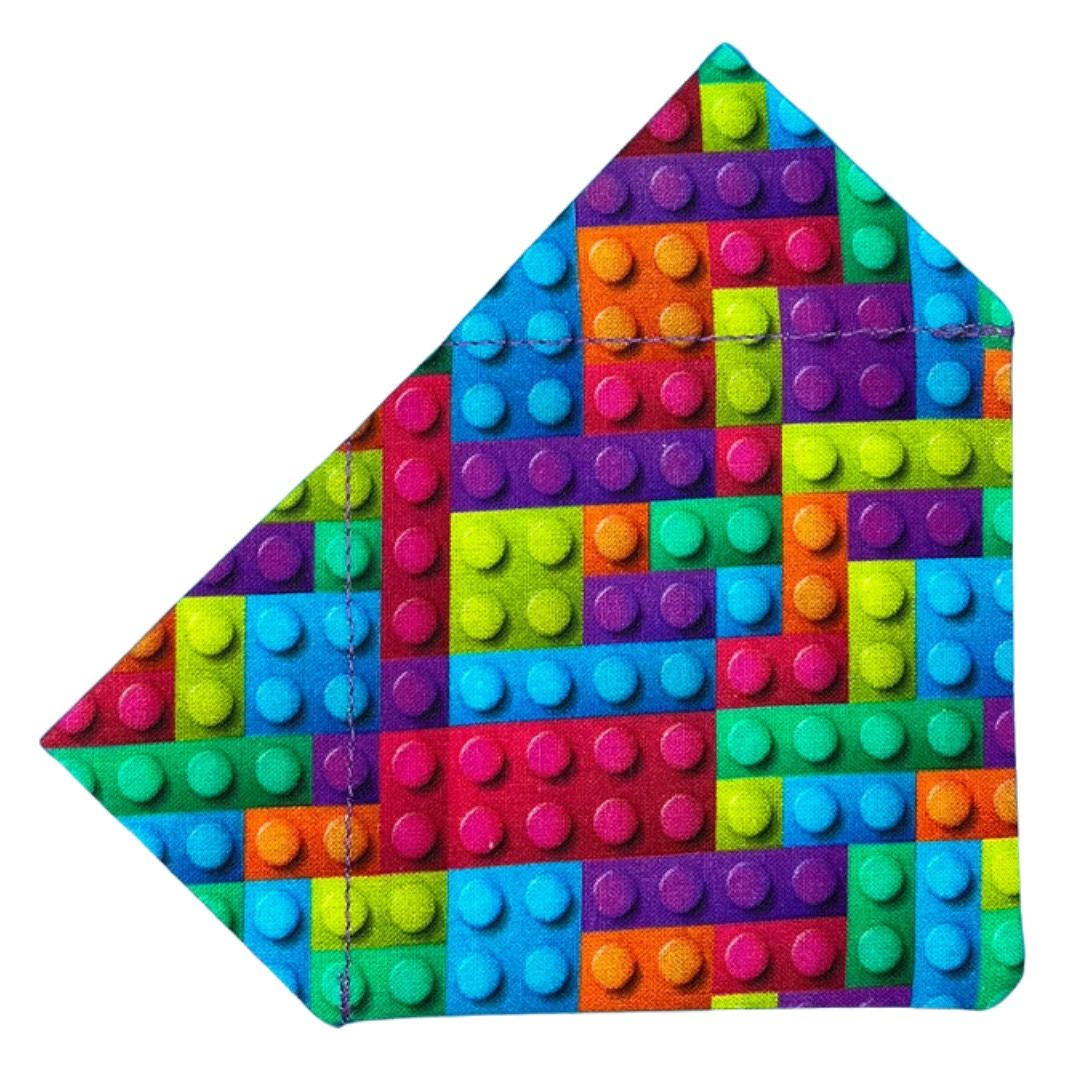 A colourful building block patterned bandana designed for dogs.