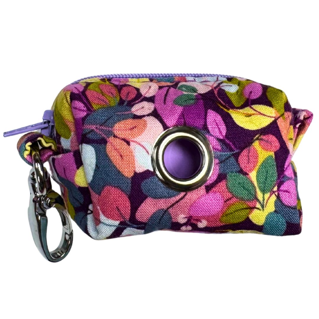 Colourful floral-patterned poo bag holder with a keychain for attaching to a lead.