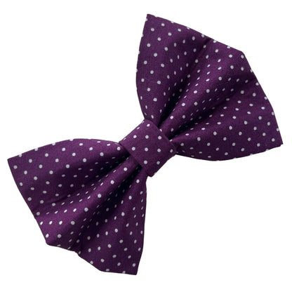 A purple dog bow tie with a blackberry spot pattern.