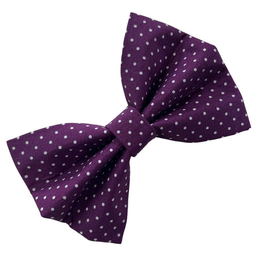 A purple dog bow tie with a blackberry spot pattern.