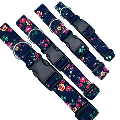 Four adjustable dog collars with a floral pattern and plastic buckles, in various sizes.
