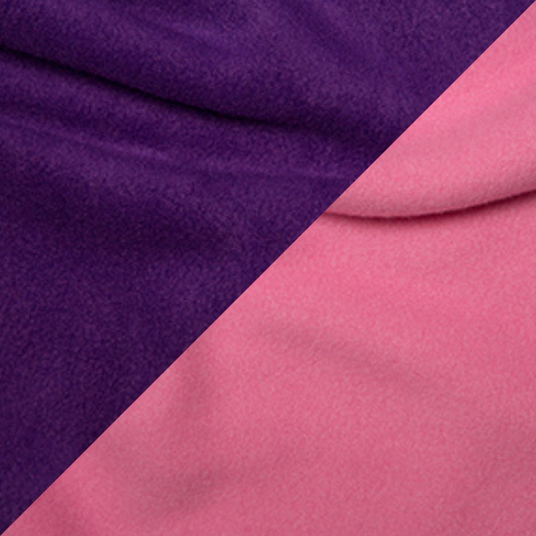 Close-up of a reversible handmade fleece dog snood with one half purple and the other half pink.