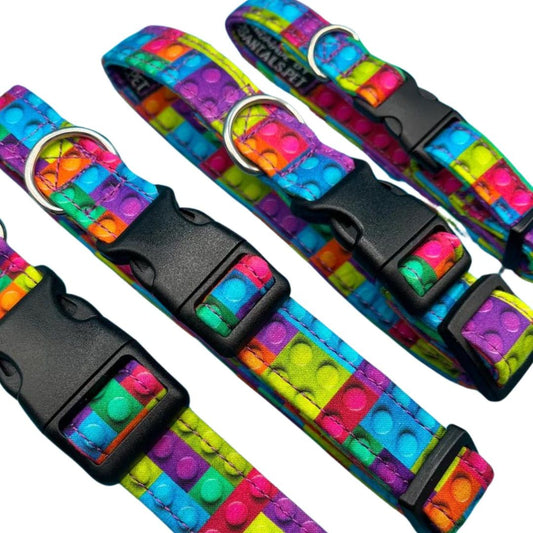 Four colourful cotton dog collars with a building block pattern.