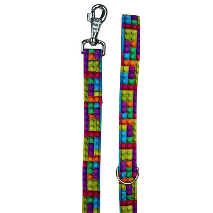 A colourful dog leash with a building block pattern and a metal swivel clip.