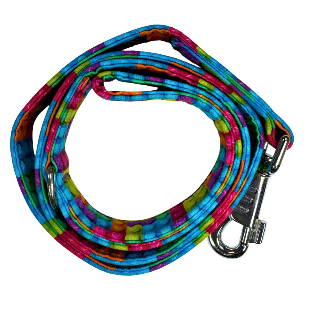 A top view of the building block dog leash which is bright and playful with a metal swivel clip.