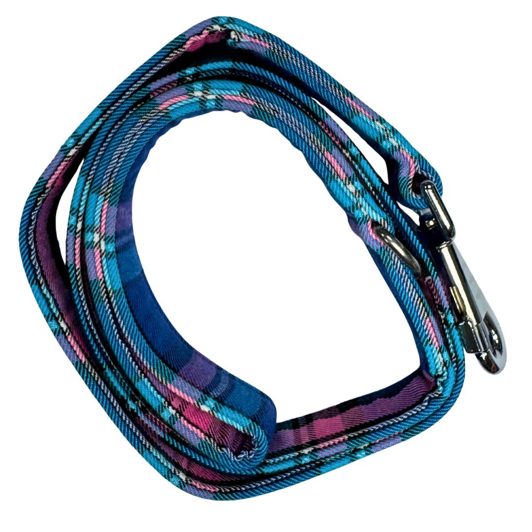 Top view of a handmade blue, pink and black tartan dog lead with a silver metal hardware and a large swivel clip.