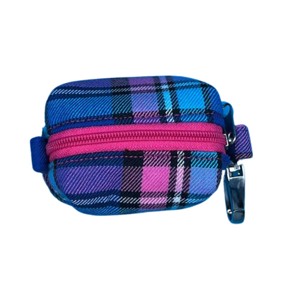 A top view of a Cambridge Tartan fabric poo bag holder with a pink zip and metal accessories.