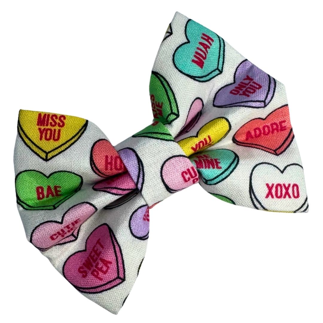 Colourful heart-shaped Dog bow with love-themed hearts