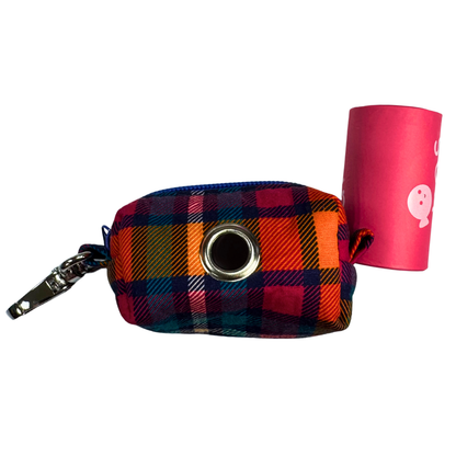 Plaid pouch with a circular opening and a roll of adios poo bags