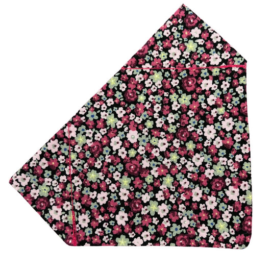 A bandana with a cherry blossom pink floral pattern on a black background.