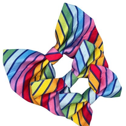 A vibrant and colourful circus stripe pattern dog bow tie in small, medium and large