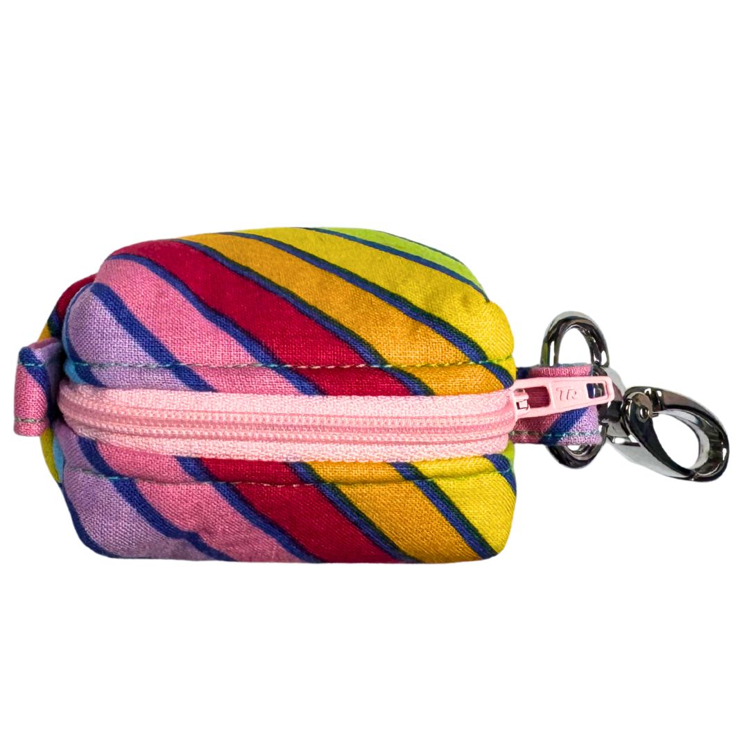 A fabric poo bag holder with circus stripe pattern, featuring a colour contrasting zip and metal accessories, with a keychain attachment.