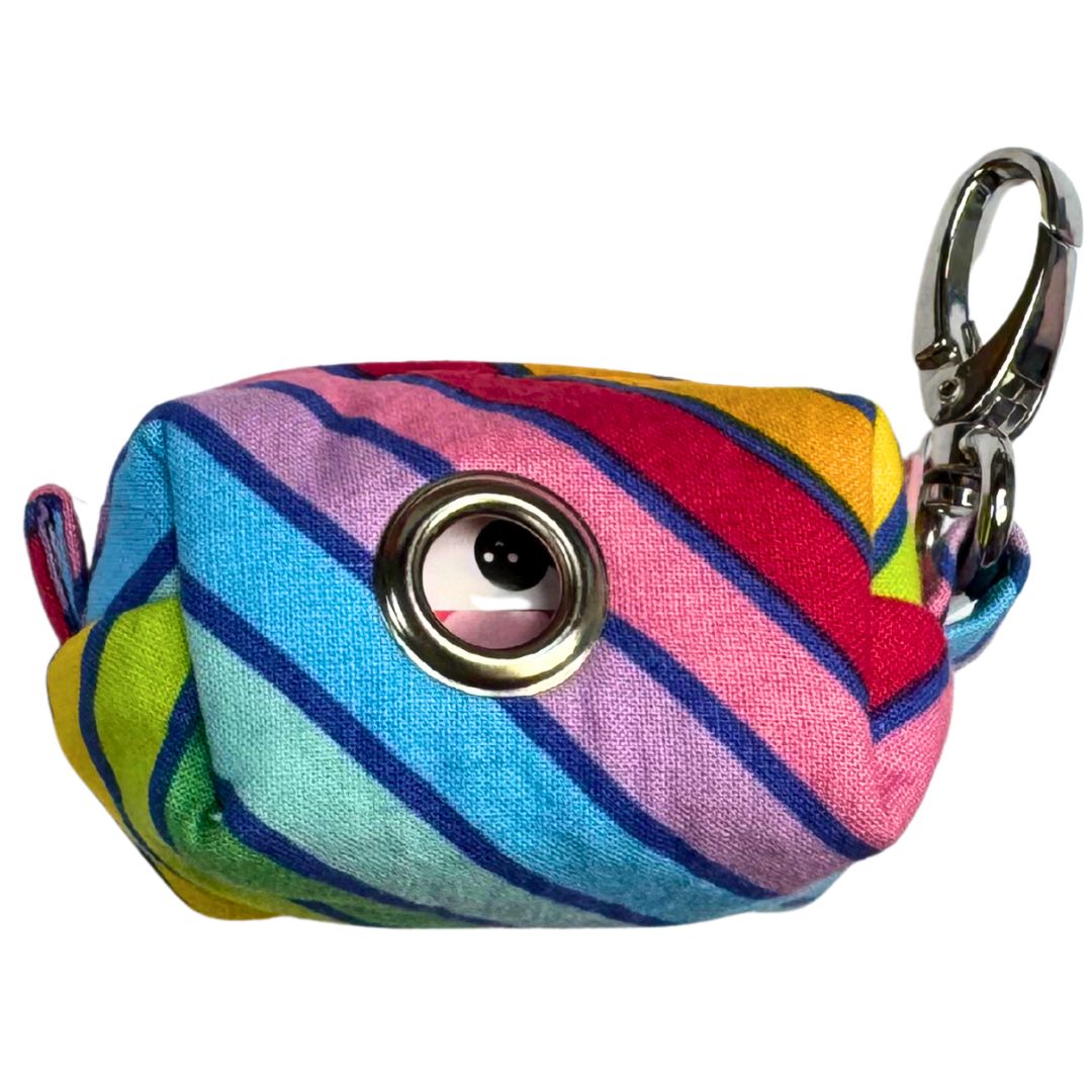 A fabric poo bag holder with circus stripe pattern, featuring a colour contrasting zip and metal accessories, with a keychain attachment.