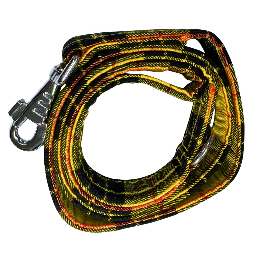 Top view of a yellow and black tartan dog lead with silver metal hardware and a large swivel clip.