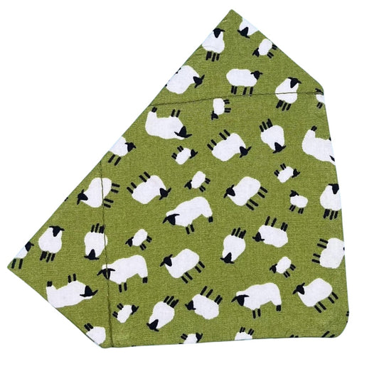 A green bandana with a pattern of white sheep distributed across the fabric.