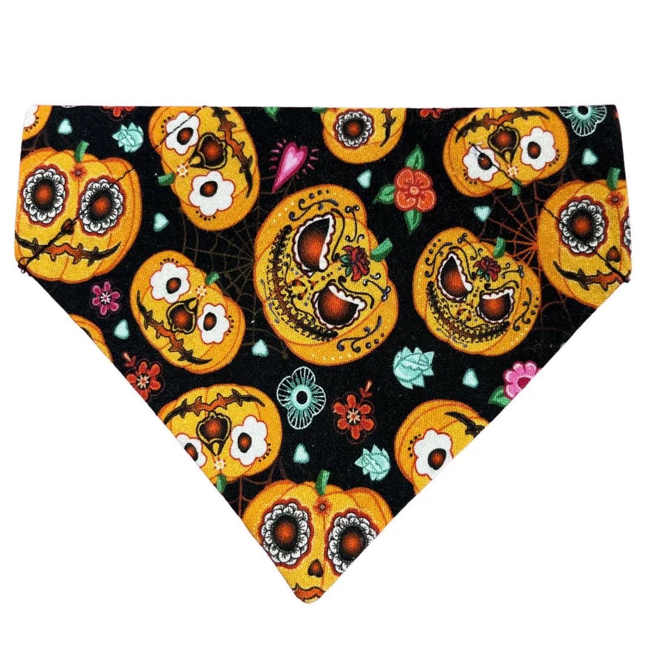 Halloween-themed bandana with pumpkins and decorative elements on a black background