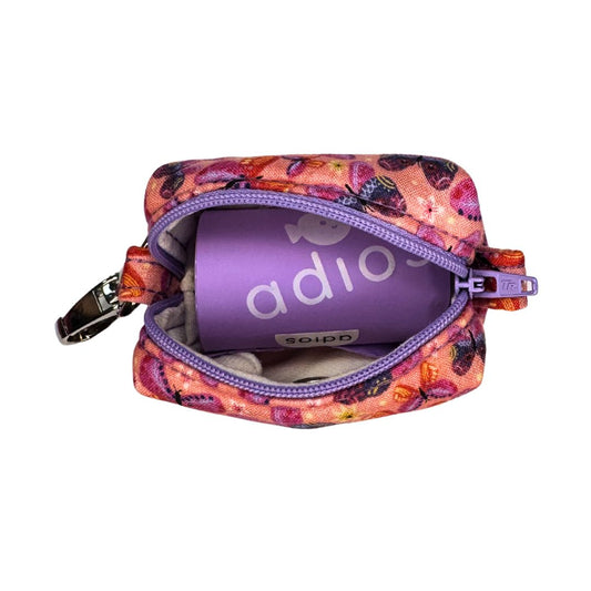 Colourful patterned pouch with a purple 'adios roll of poo bags' inside 