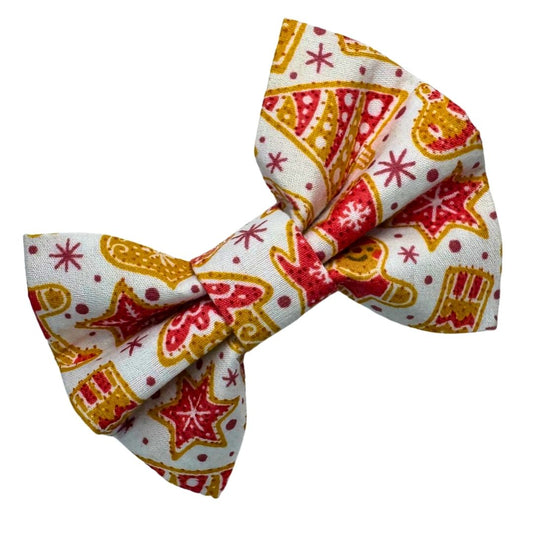 Pet bow tie with festive pattern of ginger bread, Christmas trees and stars