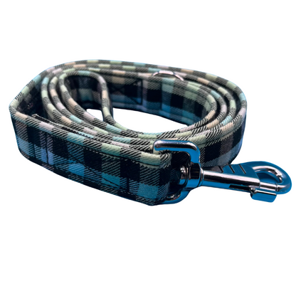 A rainbow check dog lead with silver metal hardware, including a large swivel clip and metal D ring side view