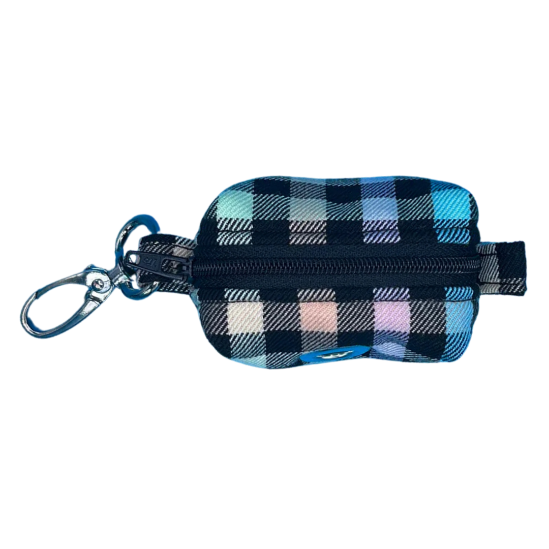 A fabric poo bag holder with a checkered pattern in rainbow colours, featuring a black zip