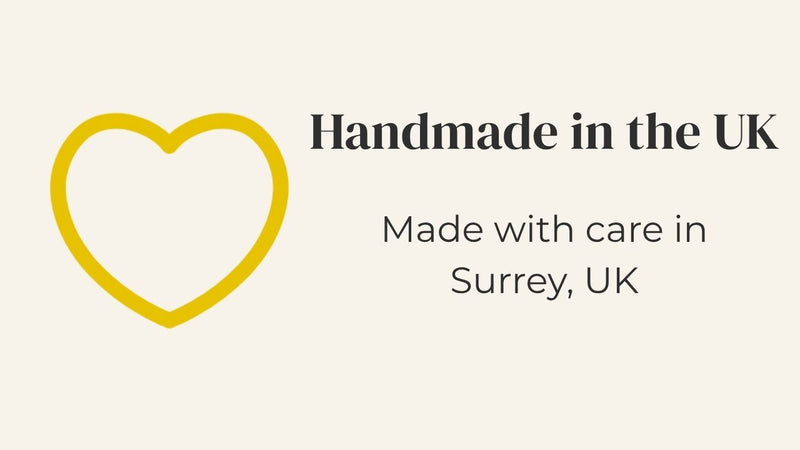 A yellow heart and text 'Handmade in the UK, Made with care in Surrey, UK'