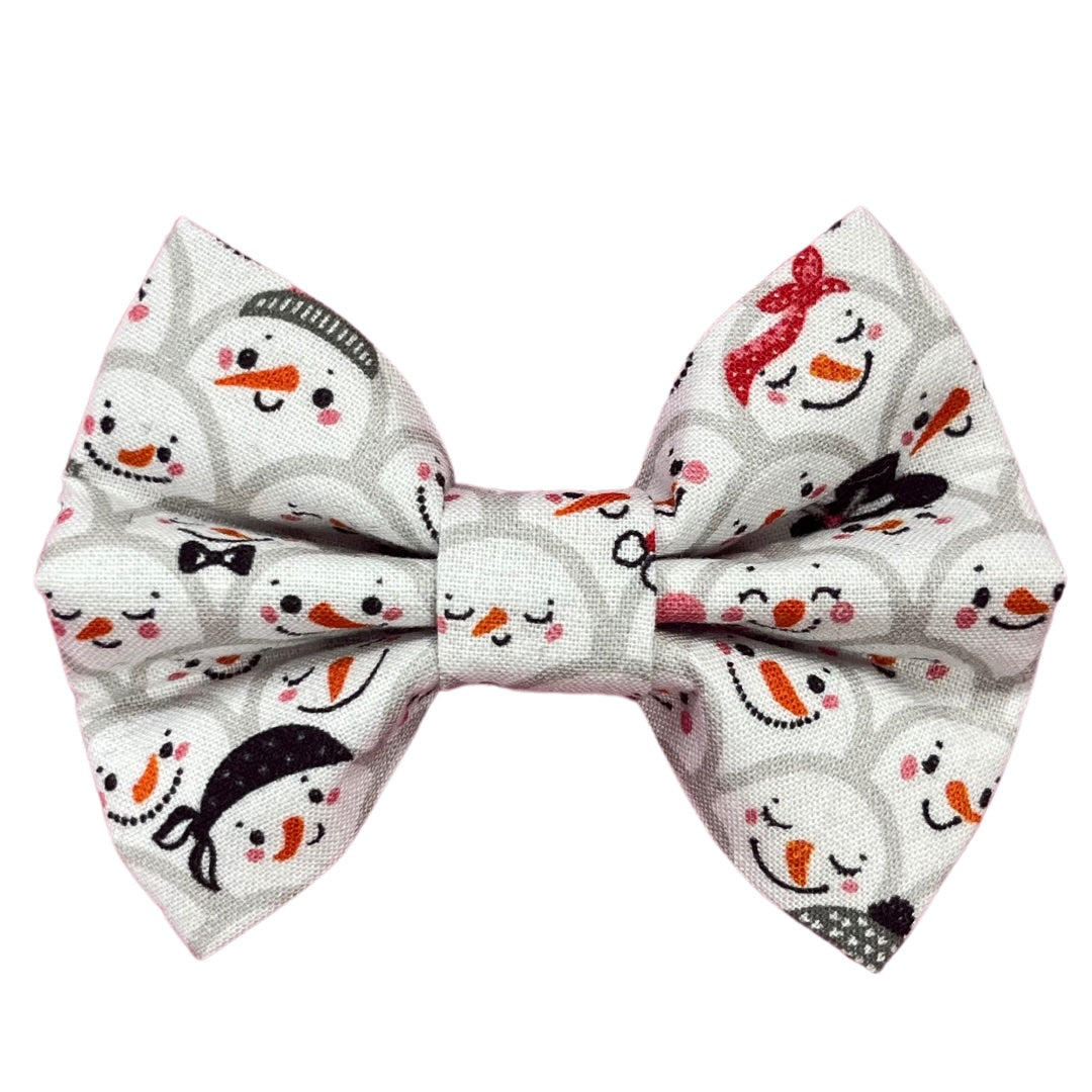 A bow tie with a Christmas-themed pattern featuring snowmen, designed for pets.