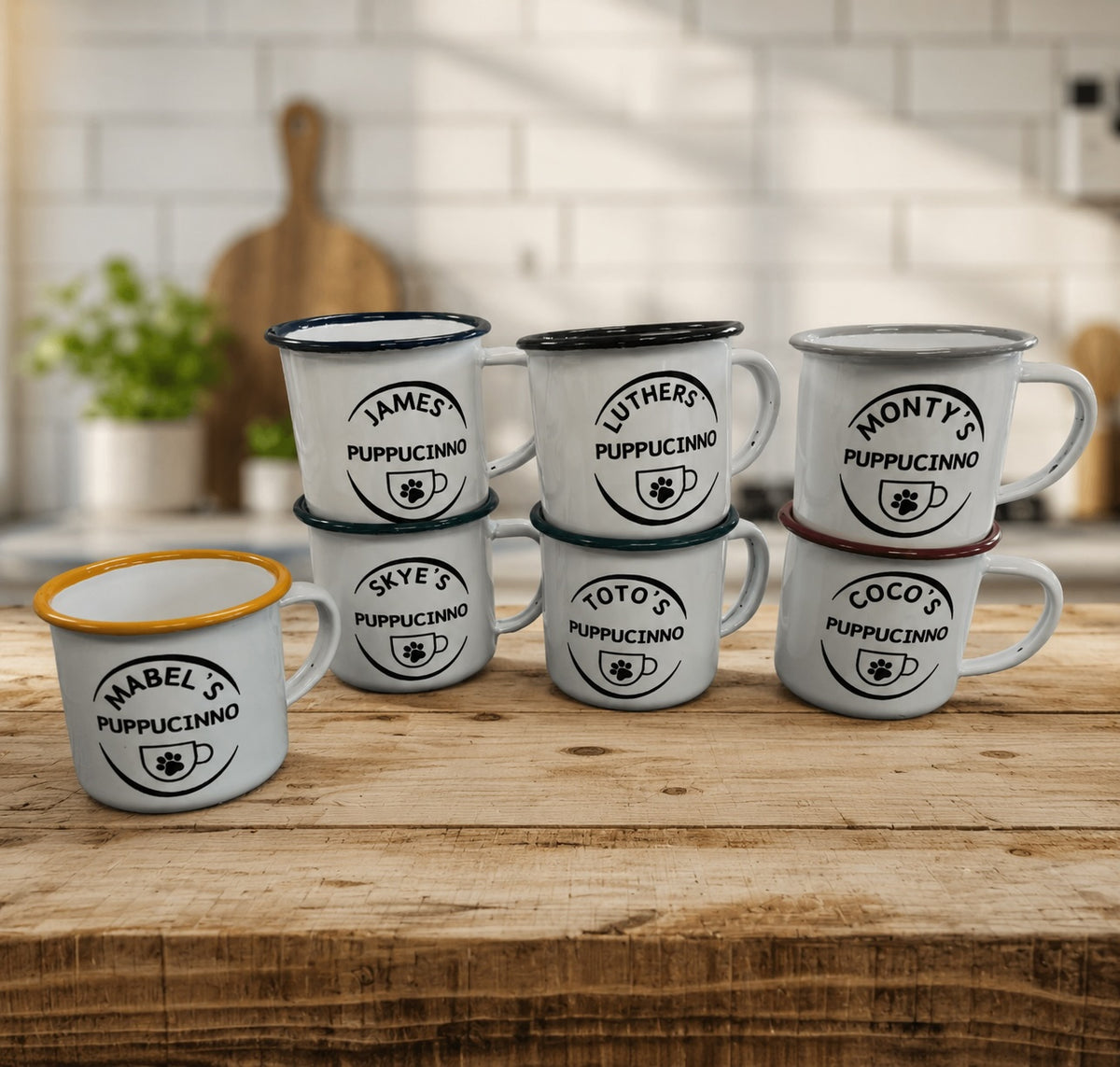 Set of white mugs with personalized names on a wooden surface