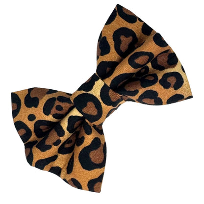 A brown and black animal print fabric dog bow.