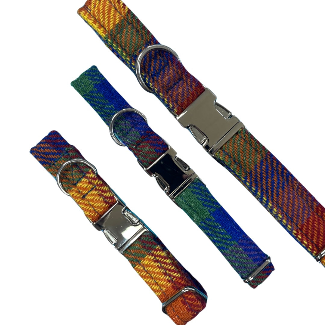 Three handmade multicolour British tweed dog collars featuring rainbow herringbone fabric, silver metal buckles, and D-rings.