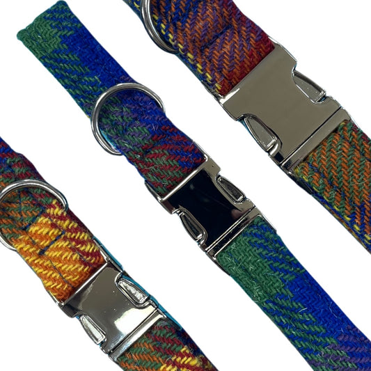 Three handmade multicolour British tweed dog collars featuring rainbow herringbone fabric, silver metal buckles, and D-rings.