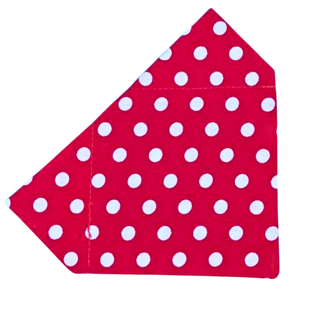 A red bandana with white polka dots designed to slip on a collar for dogs.