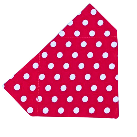 A red bandana with white polka dots designed to slip on a collar for dogs.