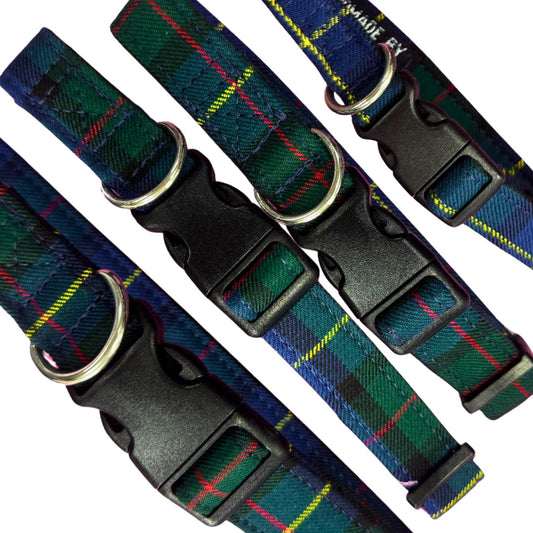Close up of the green and blue tartan patterned dog collars with black buckles on a white background