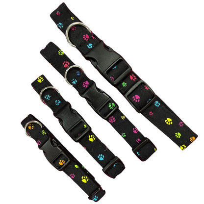 Adjustable dog collar with a paw print pattern, featuring a plastic buckle, metal and D-ring.