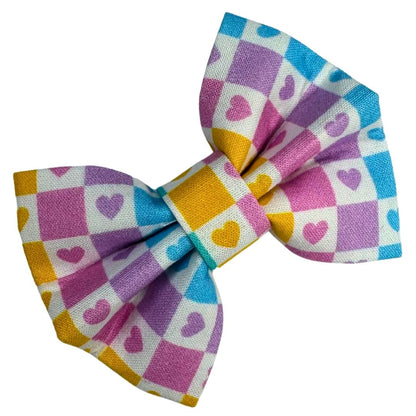 Colourful checkered bow with heart patterns
