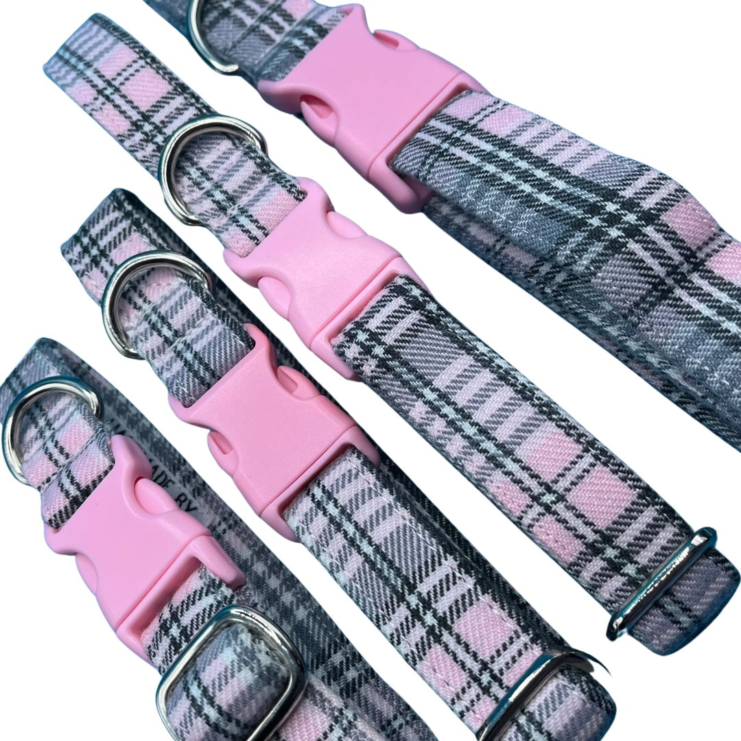Adjustable dog collars with baby pink and grey tartan pattern, silver metal D rings, plastic tri-glide adjustor, and pink buckles.