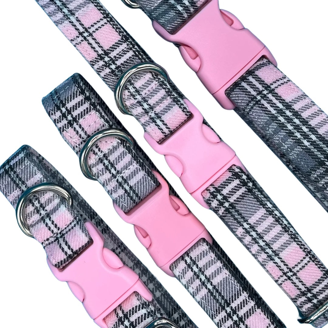 Adjustable dog collars with baby pink and grey tartan pattern, silver metal D rings, plastic tri-glide adjustor, and pink buckles.