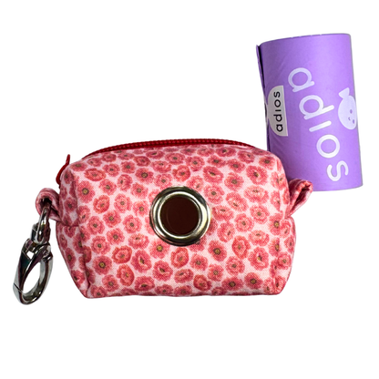 Floral-patterned pouch with keychain and purple 'adios' branded poo bags