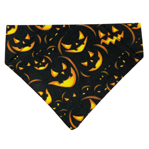 Halloween-themed bandana with jack-o'-lantern design on a black background