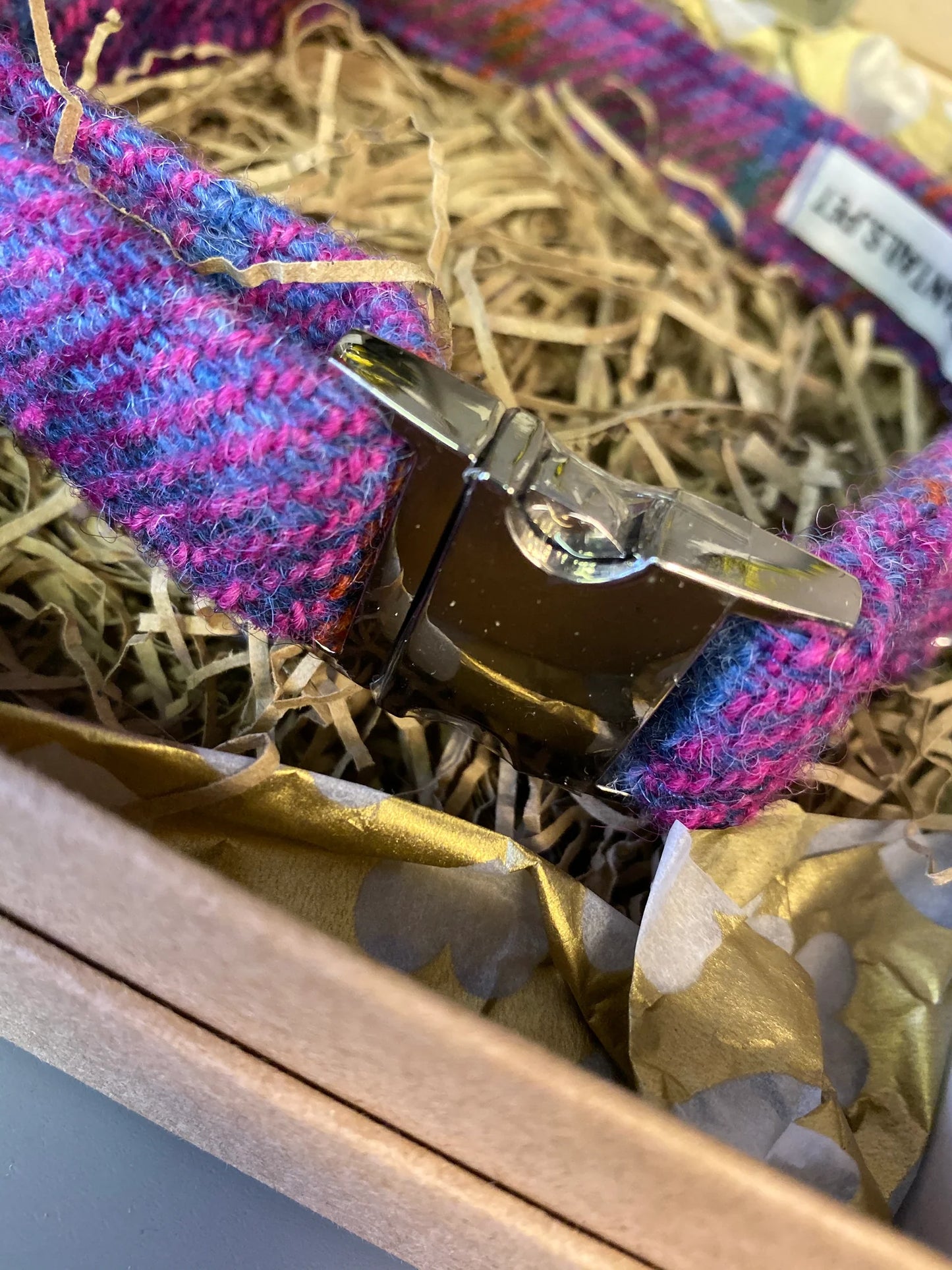 Pink and purple Harris Tweed fabric dog collar with a metal buckle in a decorative box.