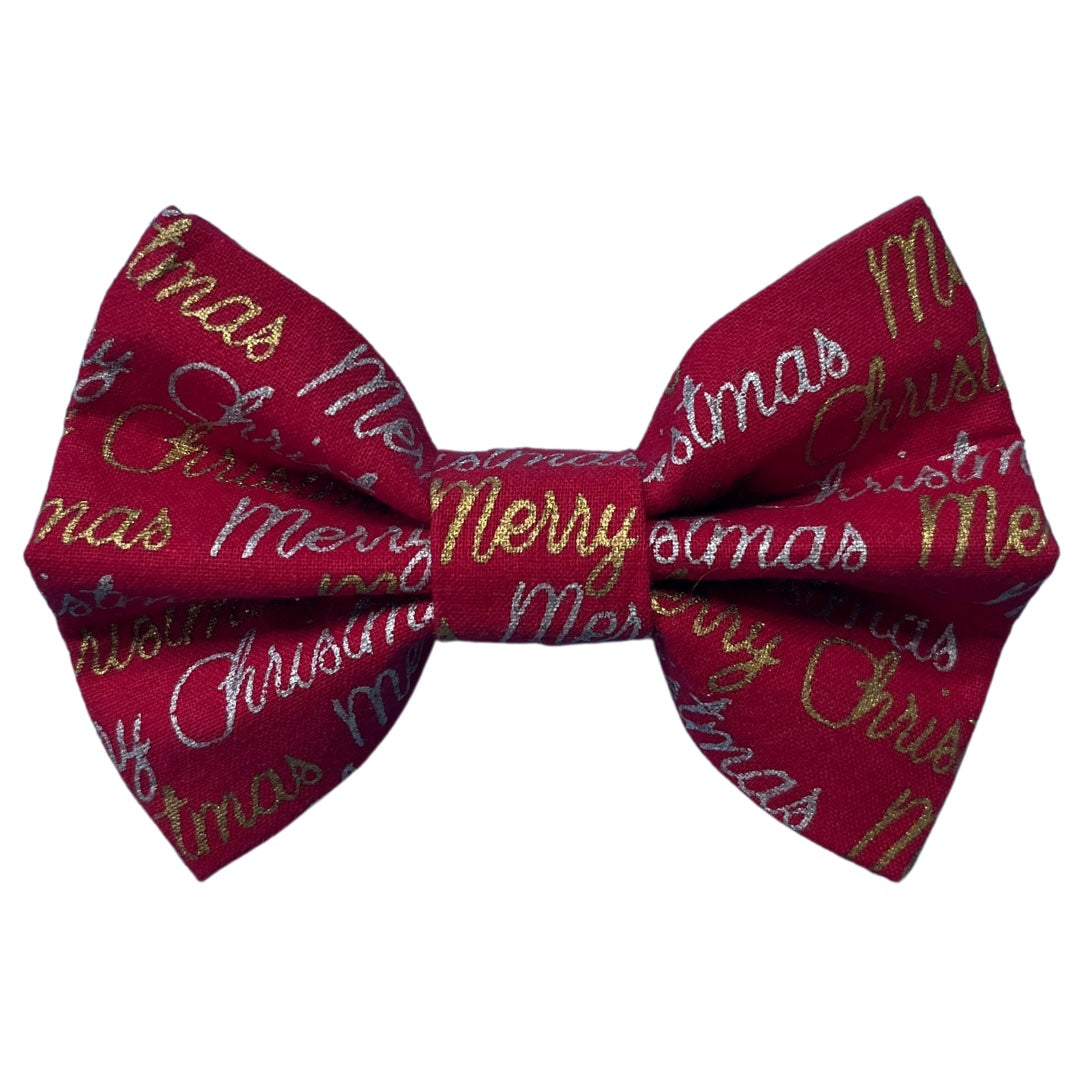 A red bow tie with 'Merry Christmas' text and gold and silver accents.