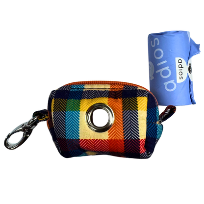 Colourful plaid poo bag holder with a keychain clip and a blue roll of adios poo bags