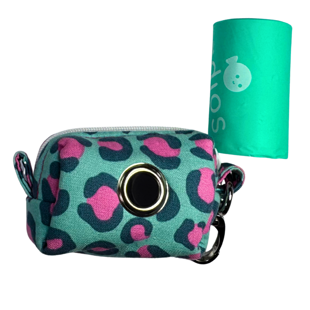 Teal pouch with pink leopard print and a roll of adios poo bags