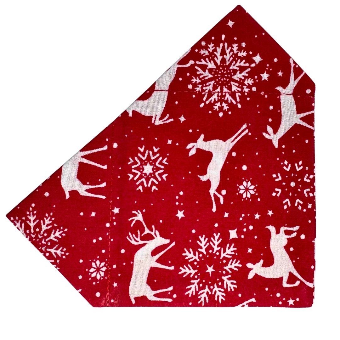 Red fabric Dog Bandana with white reindeer and snowflake pattern