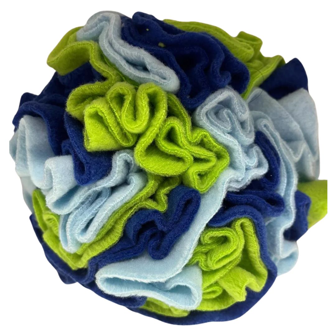 A multicoloured handmade snuffle ball made from fleece, featuring a mix of blue and green layers.