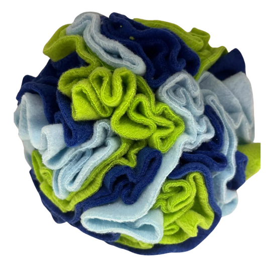 A multicoloured handmade snuffle ball made from fleece, featuring a mix of blue and green layers.