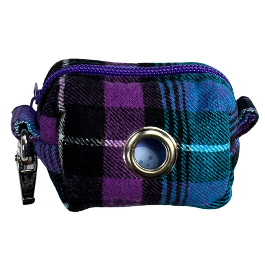 Plaid patterned poo bag holder with a purple zipper.